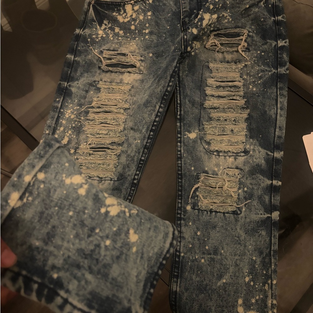 Blue Distressed Dress Pants with Unique Wear Patterns